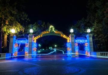 Sather Gate lit up at night