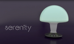 The word serenity is placed on the left side, on the right is a dimly glowing image of a round night stand lamp.