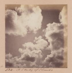 a faded sepia image of clouds in a sky.